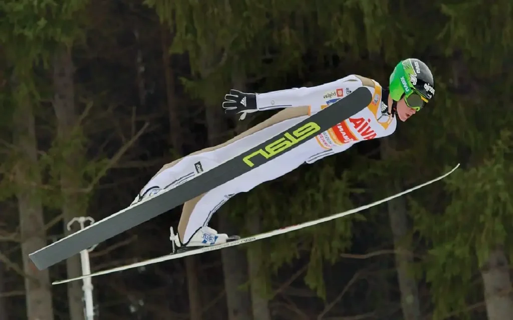 how is it possible for ski jumpers to stay in the air so long and how do they train for that